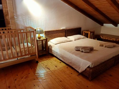 a bedroom with a large bed with towels on it at Sal&Love apt in Porto Antigo in Santa Maria