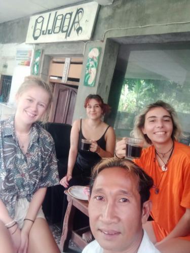 a group of people posing for a picture at Apollo Hostel in Lovina