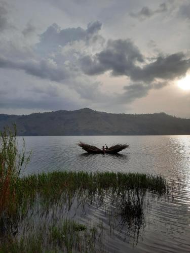 a boat on a large body of water at Isange Paradise Resort in Ruhengeri