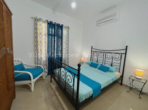 Ein Bett oder Betten in einem Zimmer der Unterkunft Maison Familiale - Vacances Turquoises