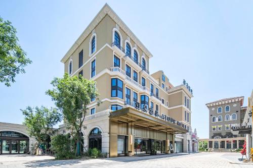 a tall building with blue windows on a street at Atour Hotel Jiashan Dazhong Plaza in Jiashan