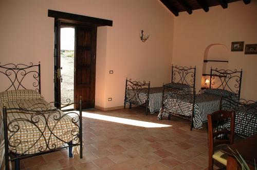 Säng eller sängar i ett rum på Agriturismo Borgo San Nicolao