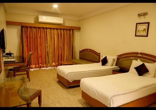 Кровать или кровати в номере Hotel AGC