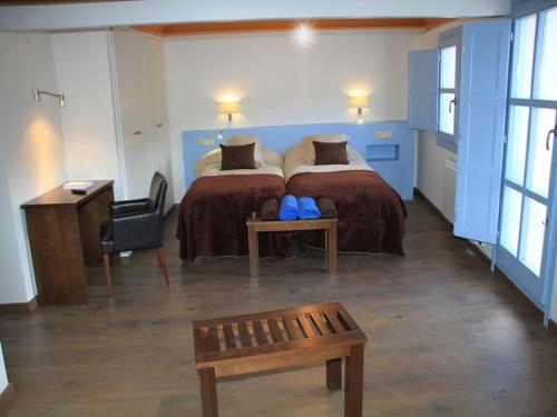 Ένα ή περισσότερα κρεβάτια σε δωμάτιο στο Ca de Costa