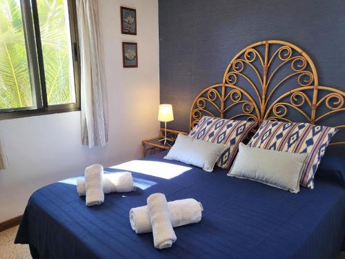 a bedroom with two beds with towels on them at Sunset Arena Beach by HelloApartments in Puerto de Santiago