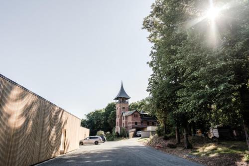 a street with a building with a clock tower at Sommers "Schöne Aussicht", Adults only in Reichenbach im Vogtland