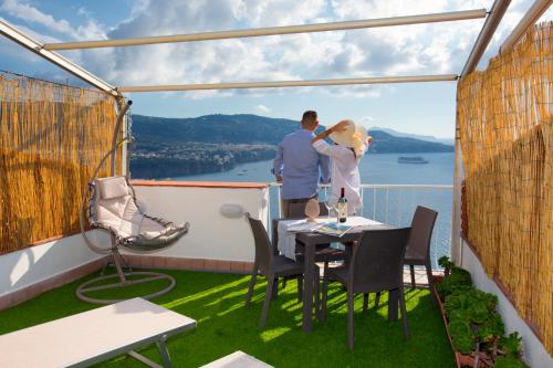 a couple standing on the balcony of a house at Dreamers' Escape in Vico Equense