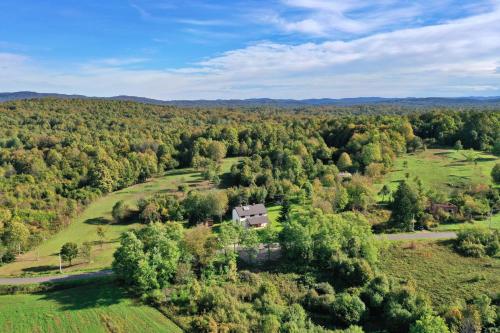 an aerial view of a house on a hill with trees at Villa Diva Grabovčeva in Rakovica