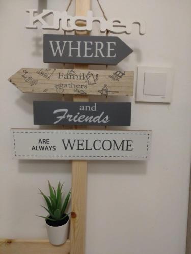 a sign that says where andfriends are always welcome at Apartman 7th Heaven in Zagreb