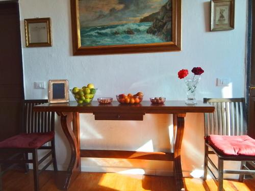 a table with fruit on it in a room at ANITA B&B in Uscio