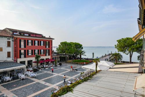 an overhead view of a street in a town with the ocean at Le Rêve - Lake view rooms in Sirmione