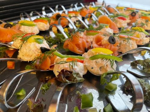 a bunch of food on a tray on a table at Hotel Krone in Königsbrunn