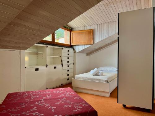 A bed or beds in a room at SIXTIES SUN & SEA MONTEROSSO
