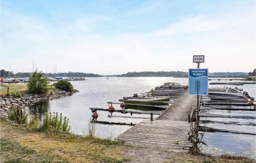 a bunch of boats are docked at a dock at 3 Bedroom Lovely Home In Ronneby in Ronneby