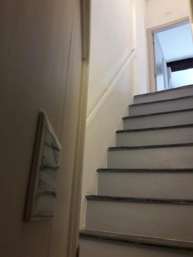 a set of stairs with a window next to it at Santa Marta Rooms - Vernazza in Vernazza