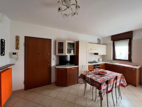 a kitchen with a table with a table cloth on it at King House in Nichelino