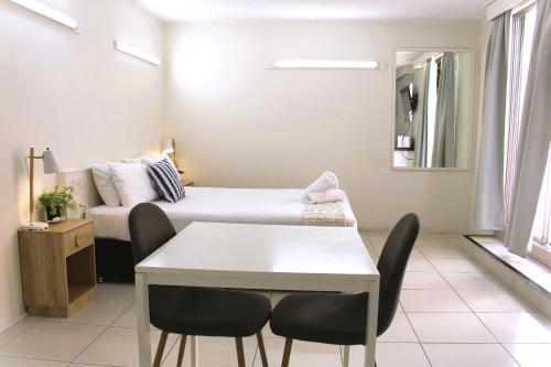 Postel nebo postele na pokoji v ubytování Camden Motor Inn