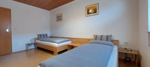 Katil atau katil-katil dalam bilik di Ferienwohnung Odenwaldblick