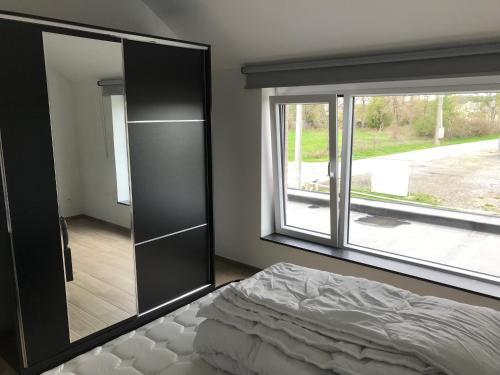 Postel nebo postele na pokoji v ubytování Vakantiehuis Relax Noiseux