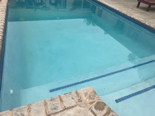 an empty swimming pool with blue water at Horizon Bed and Breakfast in Roodepoort