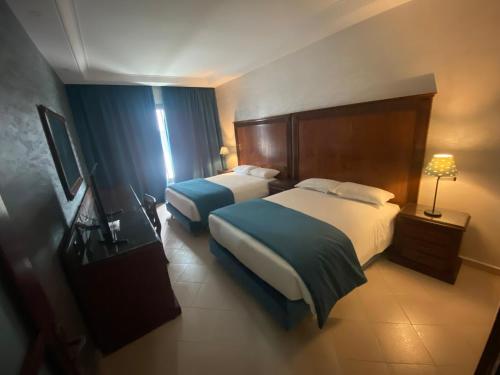 Una cama o camas en una habitación de Hotel Azur