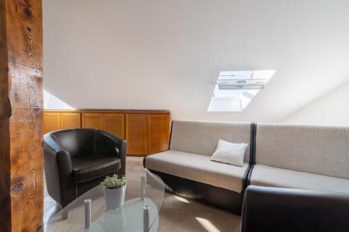 a living room with a couch and a chair at Beachfront apartments Calm Sea in Preko
