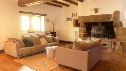 a living room with a couch and a fireplace at Maison médiévale de charme à Baden in Baden