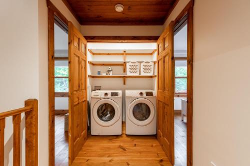 a laundry room with a washer and dryer at Chalet La Canopée -familial par excellence MontBlanc in Mont-Blanc