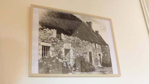 a framed picture of a building on a wall at Maison médiévale de charme à Baden in Baden