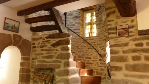 a stone staircase in a stone building with a window at Maison médiévale de charme à Baden in Baden