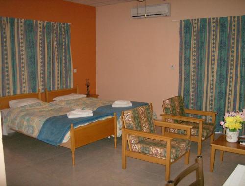 Ένα ή περισσότερα κρεβάτια σε δωμάτιο στο Rantzo Holiday Apartments