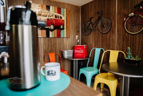 a restaurant with a table and chairs and a bike on the wall at American Classic Inn in Salida