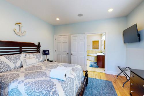 a bedroom with a bed and a flat screen tv at Emerald Cove in Moneta