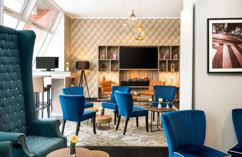 TV a/nebo společenská místnost v ubytování Leonardo Hotel Berlin
