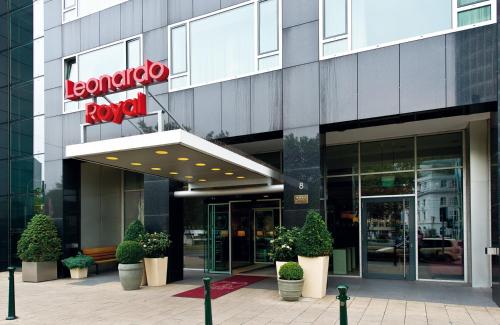 a building with a sign on the front of it at Leonardo Royal Hotel Düsseldorf Königsallee in Düsseldorf