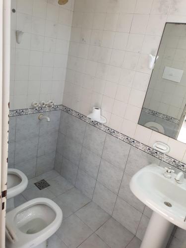 a bathroom with a toilet and a sink at (12 pers. o +) Casa quinta con pileta sobre el río PRECIO DOLAR BILLETE in Santa Fe