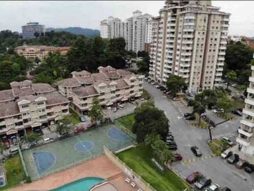 an aerial view of a city with tall buildings at The Nest - Cozy 3-Bedroom Condo with Pool in Shah Alam