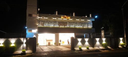 a building lit up at night with lights on it at MercuryFM 101 Yarl Mercury Inn - Jaffna in Jaffna