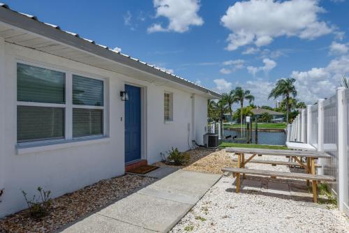 a picnic table in front of a house at Updated Waterfront Condo in Apollo Beach in Apollo Beach