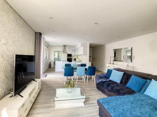 a living room with a couch and a table at Uptown Apartment by LovelyStay in Funchal