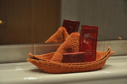 a basket of brown stuff sitting on a counter in front of a mirror at Hotel Löwen in Mellingen