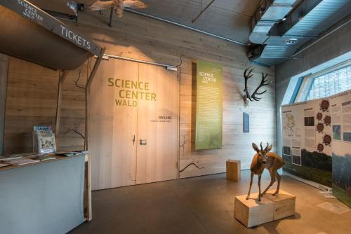 a museum with a statue of a deer on a stand at Raphael Hotel Wälderhaus in Hamburg