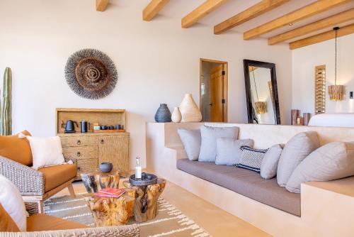 a living room with a couch and a table at Kimpton Mas Olas Resort and Spa in Todos Santos
