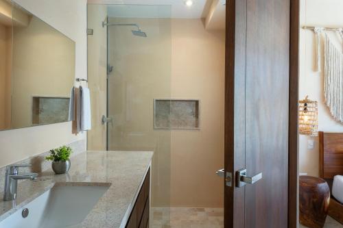 a bathroom with a sink and a shower at Luxury Condo for 4 Casa Azul in Tulum