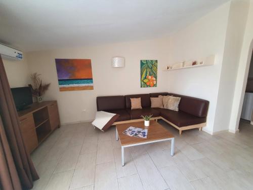 a living room with a couch and a coffee table at Appartement Amalia Sal Santa Maria in Prainha
