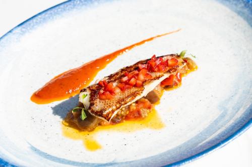 a white plate with a piece of food on it at Hotel Casa Hemingway in Juan Dolio