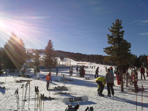 a group of people on a ski slope in the snow at Gasthof Trattner Pension Waldhof in Sankt Peter am Kammersberg
