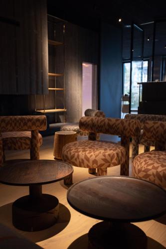a room with couches and tables in a room at HAY boutique hotel & SPA by Edem Family in Bukovel