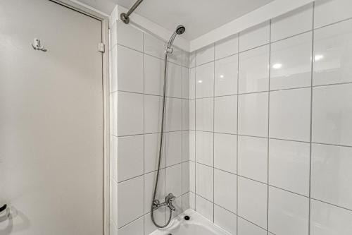 a bathroom with a shower with a glass door at Bay Dream 2B W/Wifi, Grill & View. in San Antonio