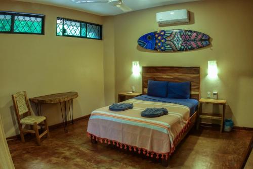 Кровать или кровати в номере Hotel Gallo de Mar